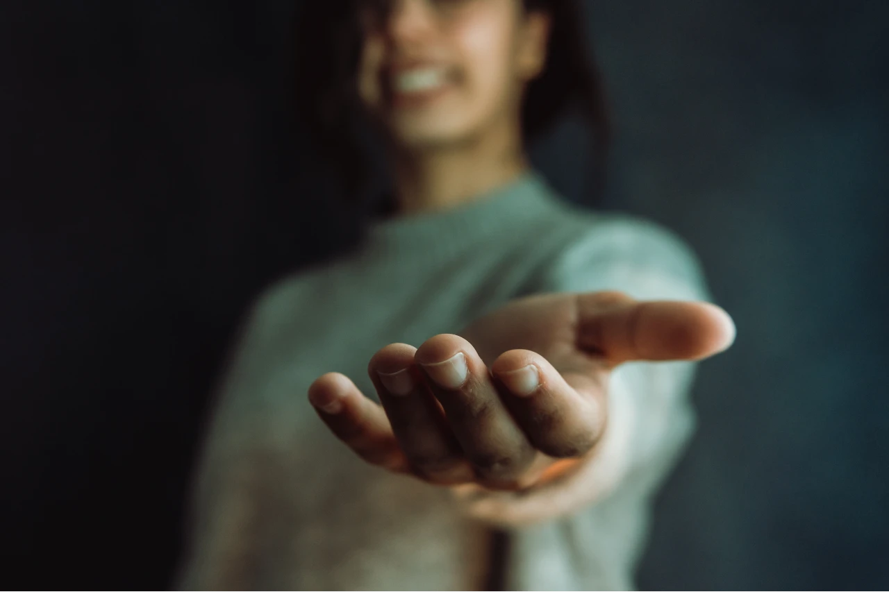 A person offering a hand for support